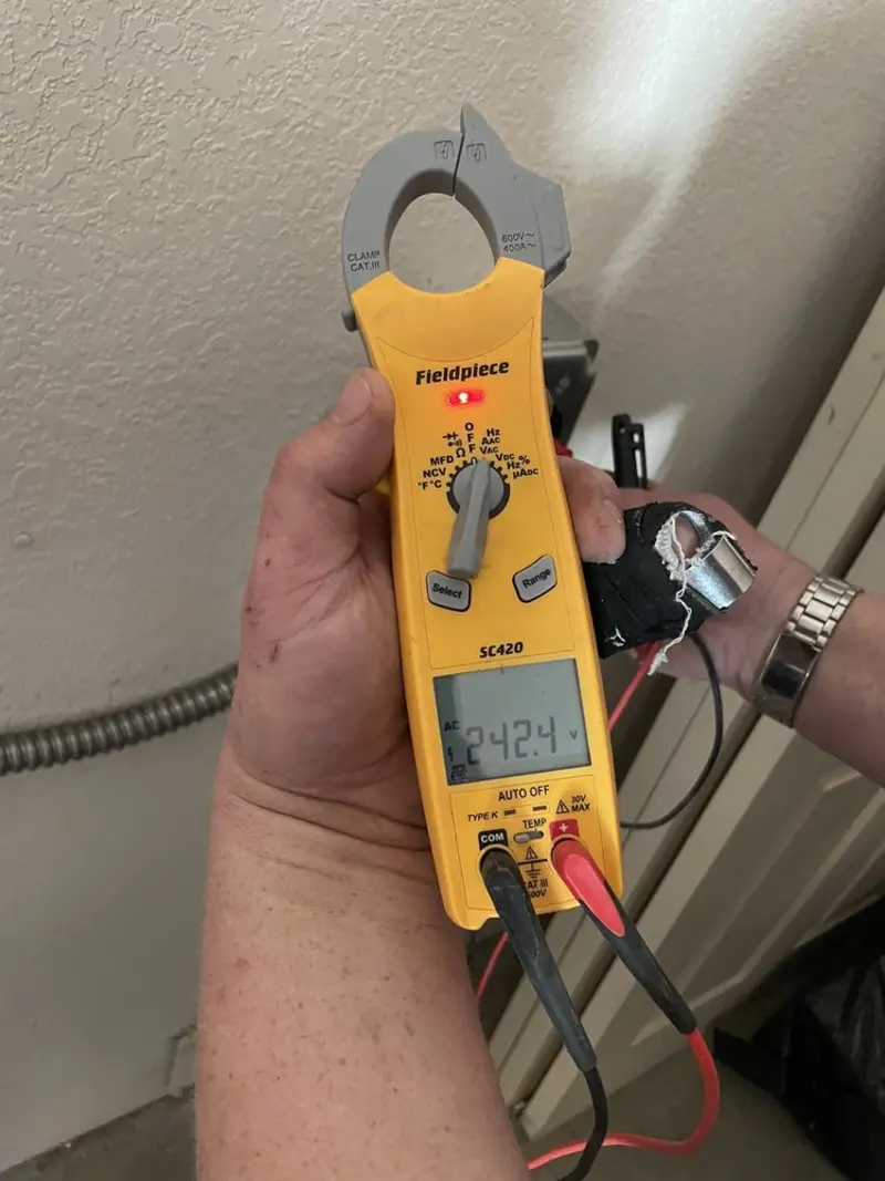 Voltage testing with clamp meter during Circuit Breaker Repair in Littleton